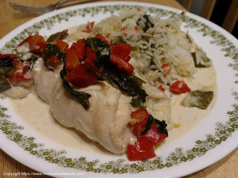 Stuffed Chicken Breast with Creamy Mushroom Sauce and White Rice.